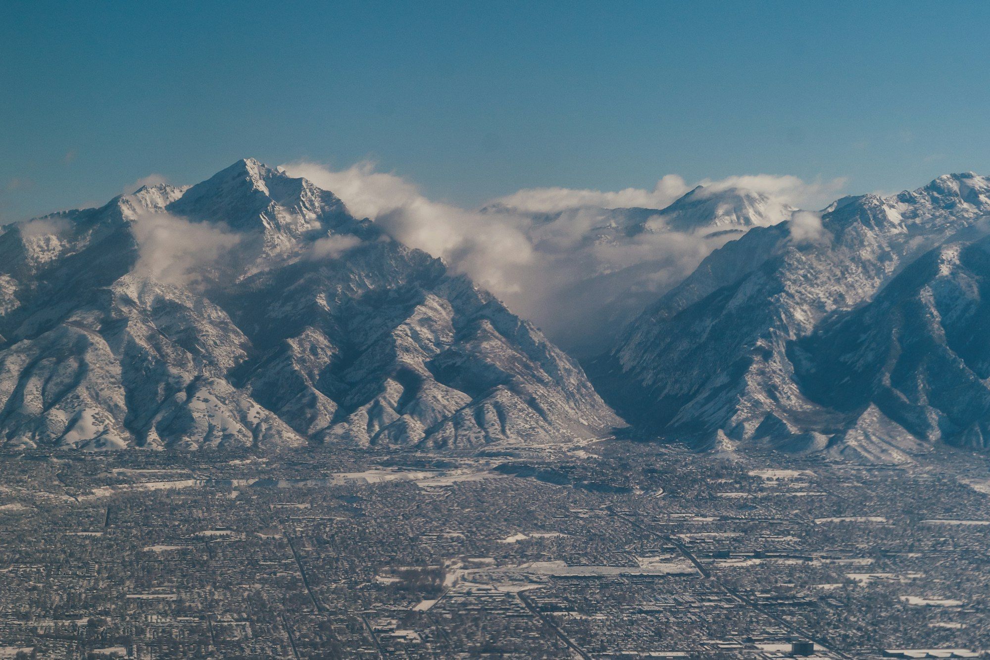 Aerial view of the Salt Lake Valley with the Wasatch Range behind it.